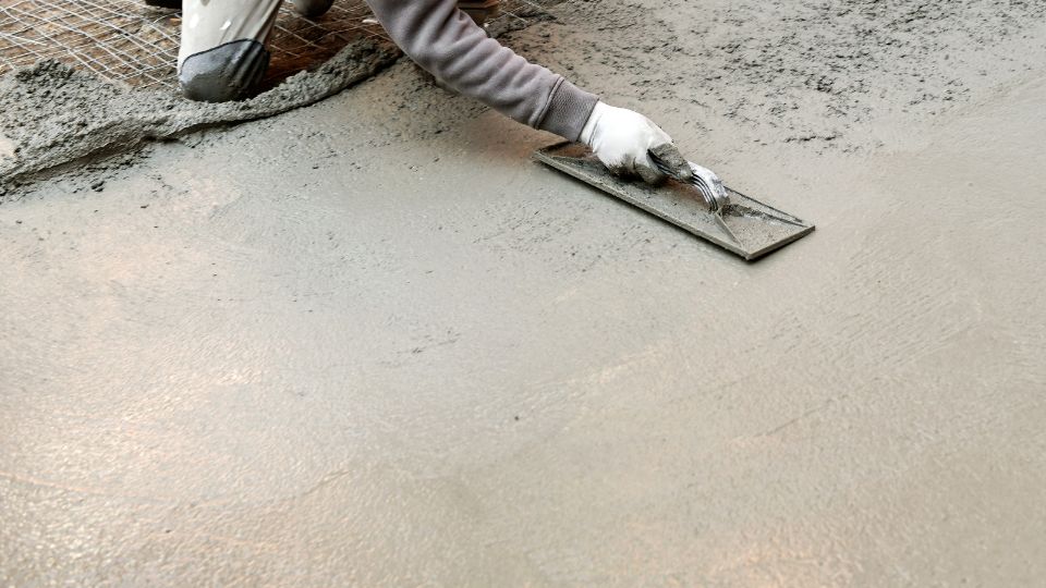 Concrete contractor resurfacing a concrete floor